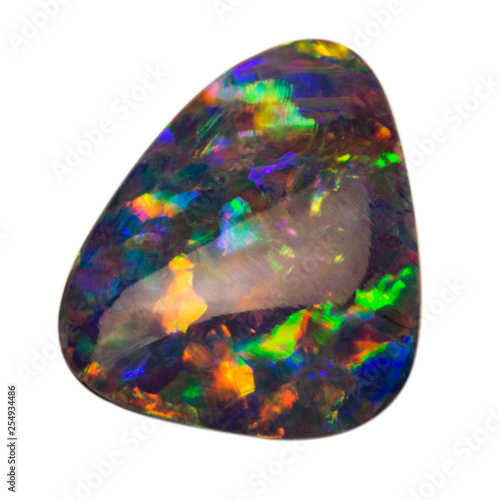 Natural blue shimmering opal macro on white background