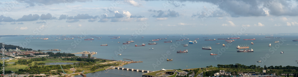 Singapore anchorage area panorama opposite Gardens by the Bay with many ships on an anchorage