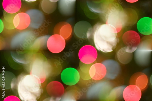 Multicolored blurry lights bokeh defocused abstract background for Christmas new year and celebration events