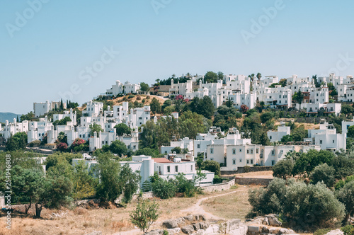 Typical white, cubic Bodrum houses in Turkey with a sea view, during sunset, summer