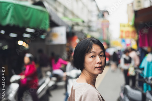 Asian woman walking on the street