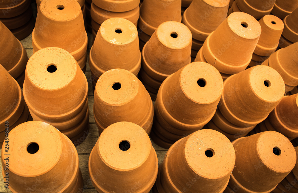 Pottery pots have the holes for drainage for planting trees in the market of Thailand Pottery pots have the holes for drainage for planting trees in the market of Thailand