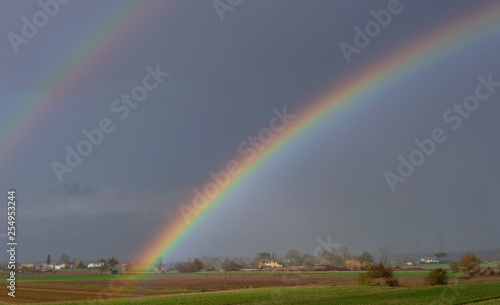 Beautiful rainbow over the countryside of the province of Pisa, Tuscany, Italy, Europe