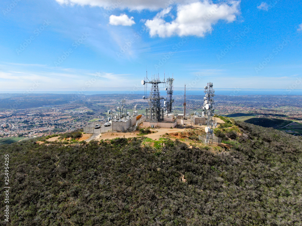 Aerial view of telecommunication antennas on the top of Black Mountain in Carmel Valley, SD, California, USA.  Television, radio and communications antenna with numerous transmitters, Technology.