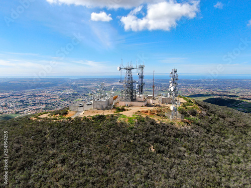 Aerial view of telecommunication antennas on the top of Black Mountain in Carmel Valley, SD, California, USA. Television, radio and communications antenna with numerous transmitters, Technology.