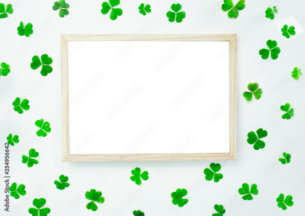 Green leaves with white board on white background with space for your ideas texts. top view. 