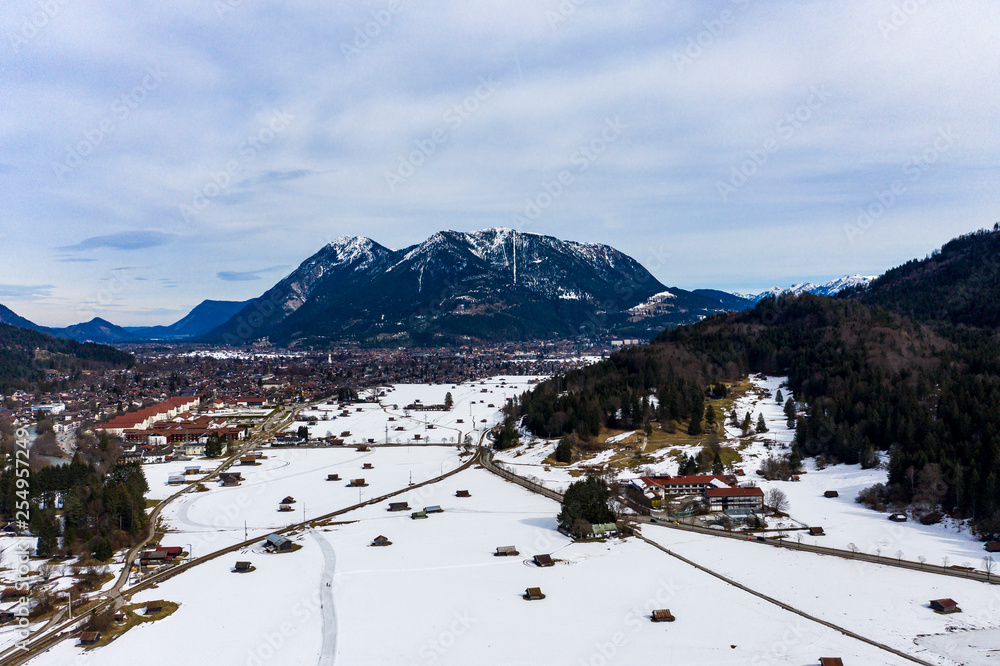 Aerial view, Wetterstein Mountains with Zugspitze and Alpspitze, Garmisch - Partenkirchen, Heutstadl on snowy meadow, Bavaria, Germany