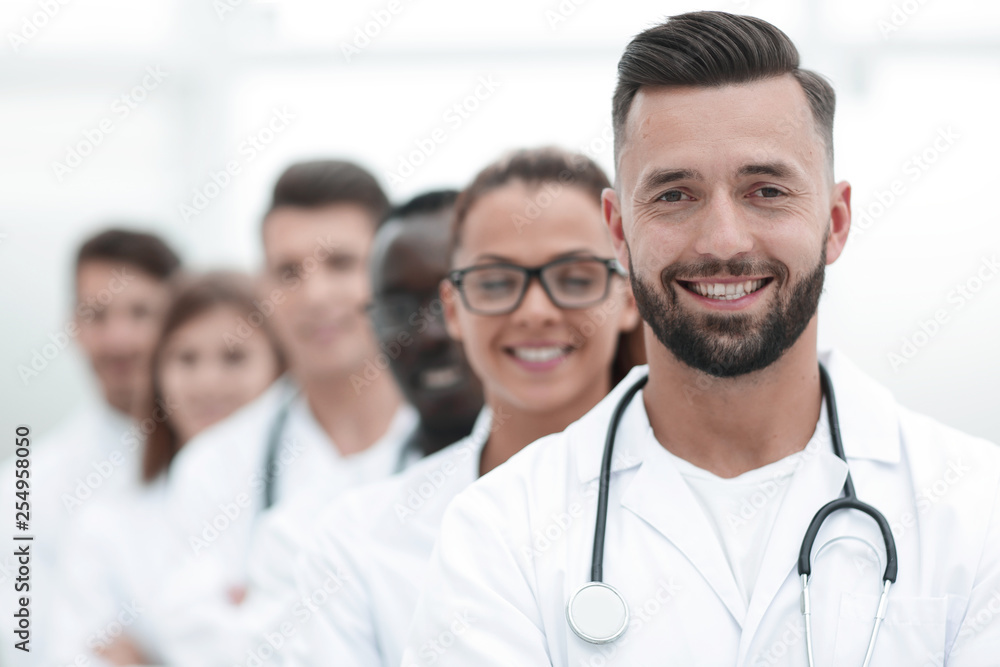 Team of smiling professional doctors standing together Team of smiling professional doctors standing together