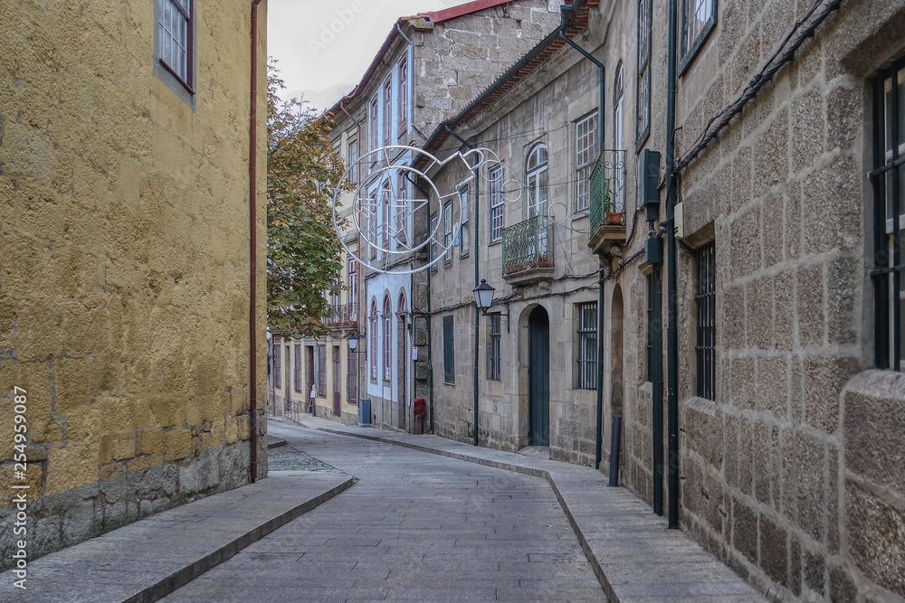 Narrow street of the historic area of Guimaraes, Portugal