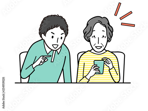 おばあちゃんにスマホの使い方を教える孫