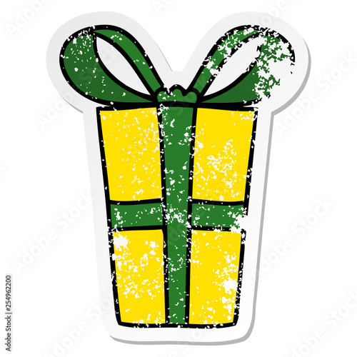 distressed sticker of a quirky hand drawn cartoon present