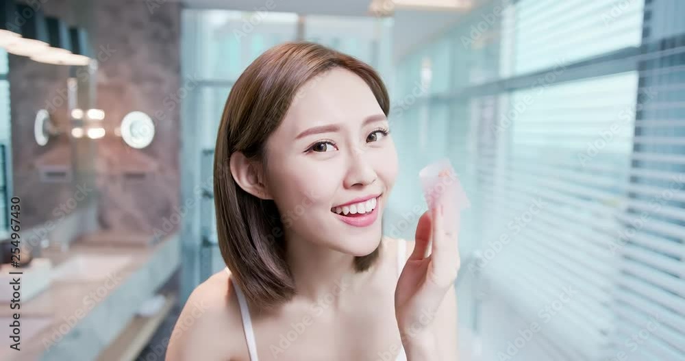 woman use oil blotting paper woman use oil blotting paper
