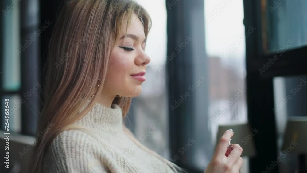 custom made wallpaper toronto digitalClose up view of attractive blonde woman spraying perfumes on her neck. Confidence, cosmetics, loving. Preparation process, enjoying delightful smell. Female portrait