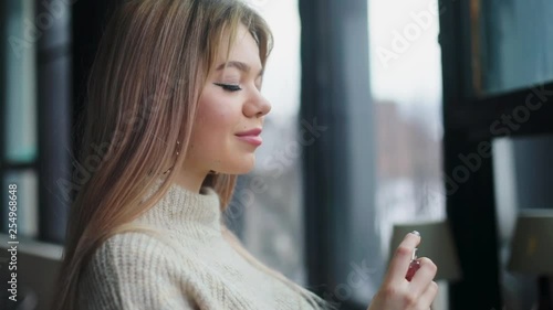 Wallpaper Mural Close up view of attractive blonde woman spraying perfumes on her neck. Confidence, cosmetics, loving. Preparation process, enjoying delightful smell. Female portrait Torontodigital.ca