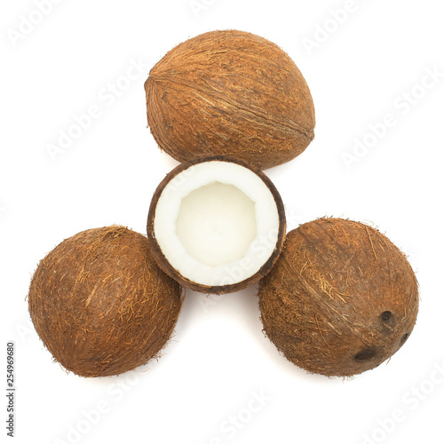 Coconuts whole and half isolated on white background. Tropical fruit. Flat lay, top view