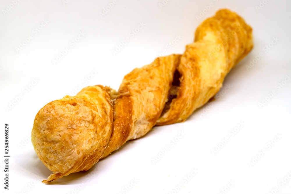 Puff pastry photo closeup on white background. Bakery studio photo. Warm fresh puff pastry closeup