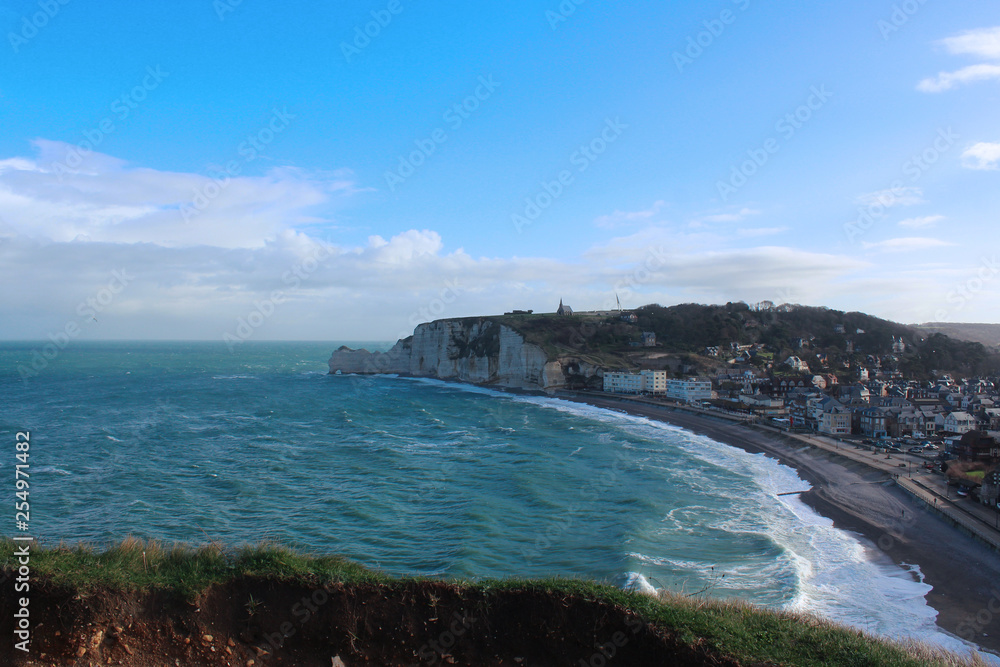 Picturesque panoramic landscape on the cliffs of Etretat. Natural amazing cliffs. Etretat, Normandy, France, La Manche or English Channel. Coast of the Pays de Caux area in sunny summer day 