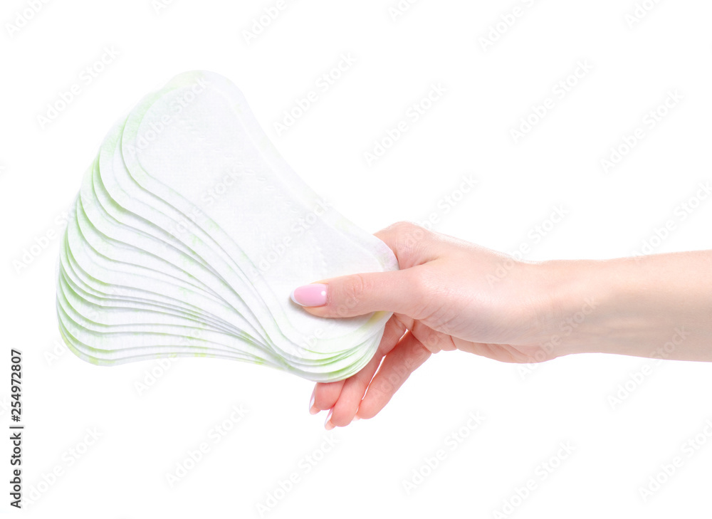 Sanitary pad daily panty liner in hand on white background isolation Sanitary pad daily panty liner in hand on white background isolation