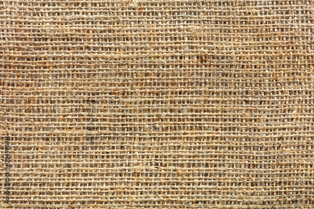 The background and texture of the weave of old burlap The background and texture of the weave of old burlap