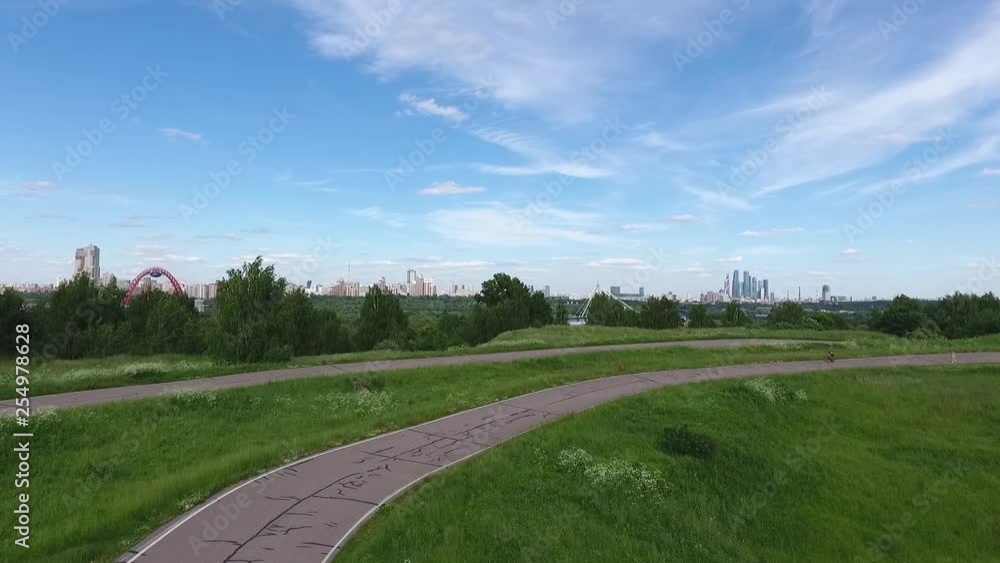 Sky over Western Administrative District in Moscow, Russia. View Moscow, Krylatsky Hills, cycle track, Krylatskaya cycle road drone Olympic cycle track rowing canal Sky over Western Administrative District in Moscow, Russia. View Moscow, Krylatsky Hills, cycle track, Krylatskaya cycle road drone Olympic cycle track rowing canal