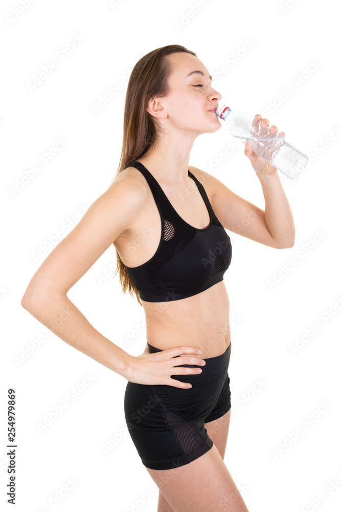 Beautiful young sport woman resting and drinking water in the gym fitness Beautiful young sport woman resting and drinking water in the gym fitness