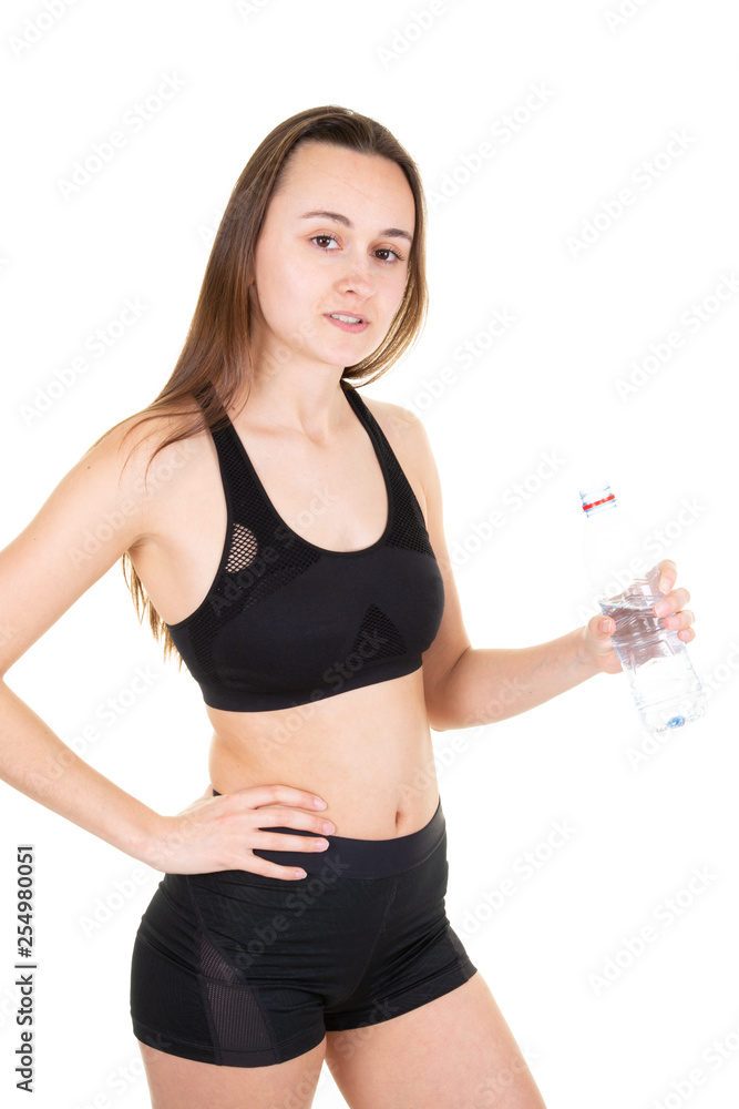 Girl drinking water from bottle after running sport gym Girl drinking water from bottle after running sport gym