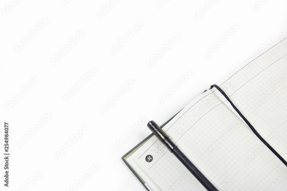 open daily planner with black pen on white background open daily planner with black pen on white background