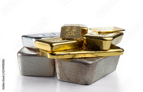 Several different gold and silver bullion. isolated on white background. photo