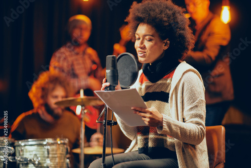 Photos Mixed race woman singing