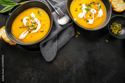 Pumpkin creamy soup served in bowls