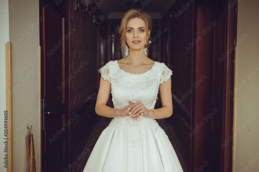 Fashion bride in gorgeous wedding dress studio portrait. Beautiful model with bridal makeup and hairstyle in marriage lace dress. Fashion bride in gorgeous wedding dress studio portrait. Beautiful model with bridal makeup and hairstyle in marriage lace dress.