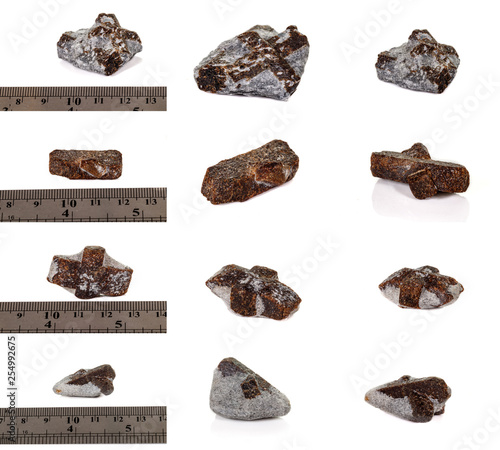 macro mineral stone Staurolite on a white background photo