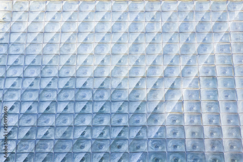 Background of glass. The texture of the squares of glass. Glass wall of the building. Abstract pattern