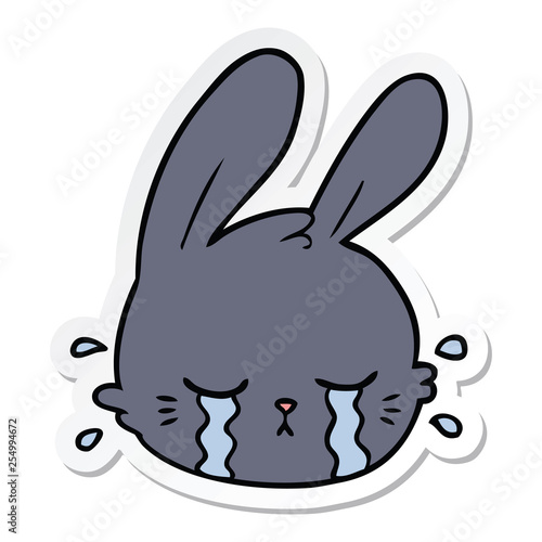 sticker of a cartoon rabbit face crying