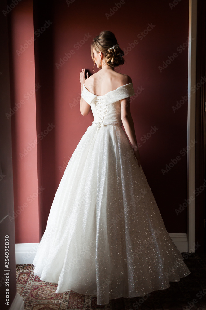 Portrait of a beautiful bride woman in elegant white wedding dress. Luxurious apartments. Portrait of a beautiful bride woman in elegant white wedding dress. Luxurious apartments.