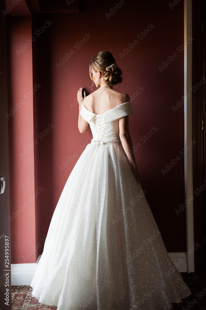 Portrait of a beautiful bride woman in elegant white wedding dress. Luxurious apartments. Portrait of a beautiful bride woman in elegant white wedding dress. Luxurious apartments.