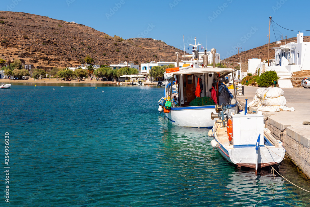 Fishing boats moored in the port of the picturesque village of Faros in Sifnos. Greece Fishing boats moored in the port of the picturesque village of Faros in Sifnos. Greece