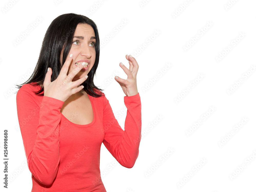 A very angry beautiful young woman is clenching her fingers in A very angry beautiful young woman is clenching her fingers in