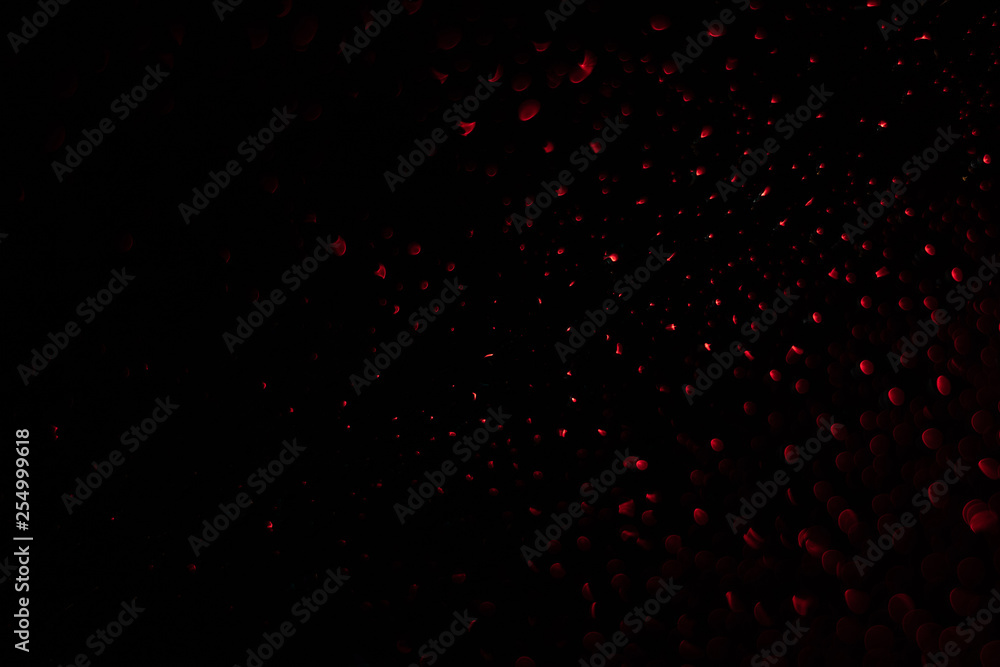 Colored drops on a glass at night Colored drops on a glass at night