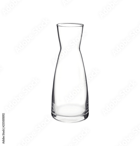 Empty glass carafe isolated on white background. Side view. photo
