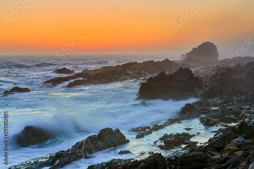 Rocky coast after sunset