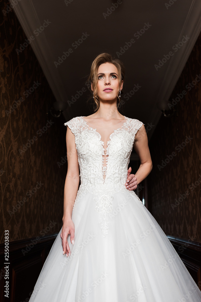 Morning of the bride when she wears a beautiful dress, woman getting ready before wedding ceremony Morning of the bride when she wears a beautiful dress, woman getting ready before wedding ceremony