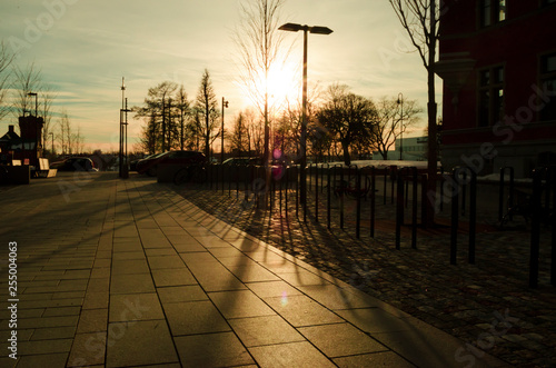 Yellow sunset light and shadow on the floor in an outdoor park © Souvik