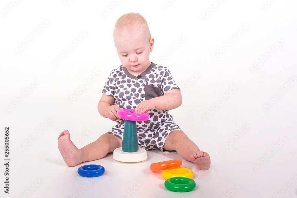 kid piles a pyramid on a white background kid piles a pyramid on a white background