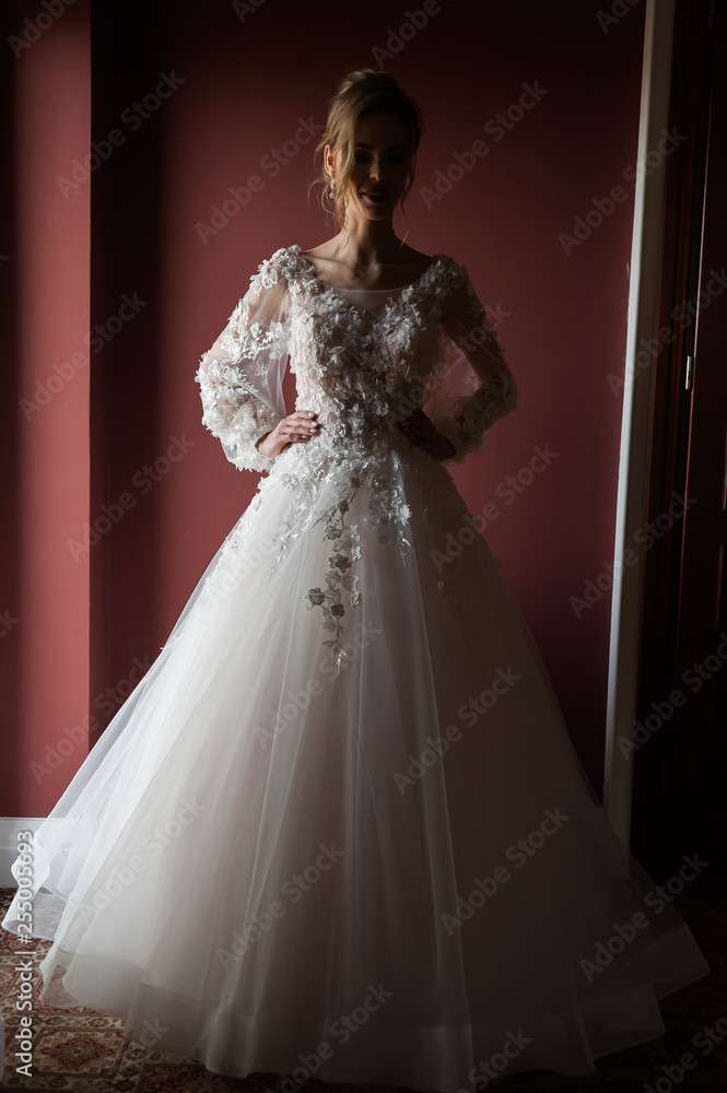 Morning of the bride when she wears a beautiful dress, woman getting ready before wedding ceremony Morning of the bride when she wears a beautiful dress, woman getting ready before wedding ceremony