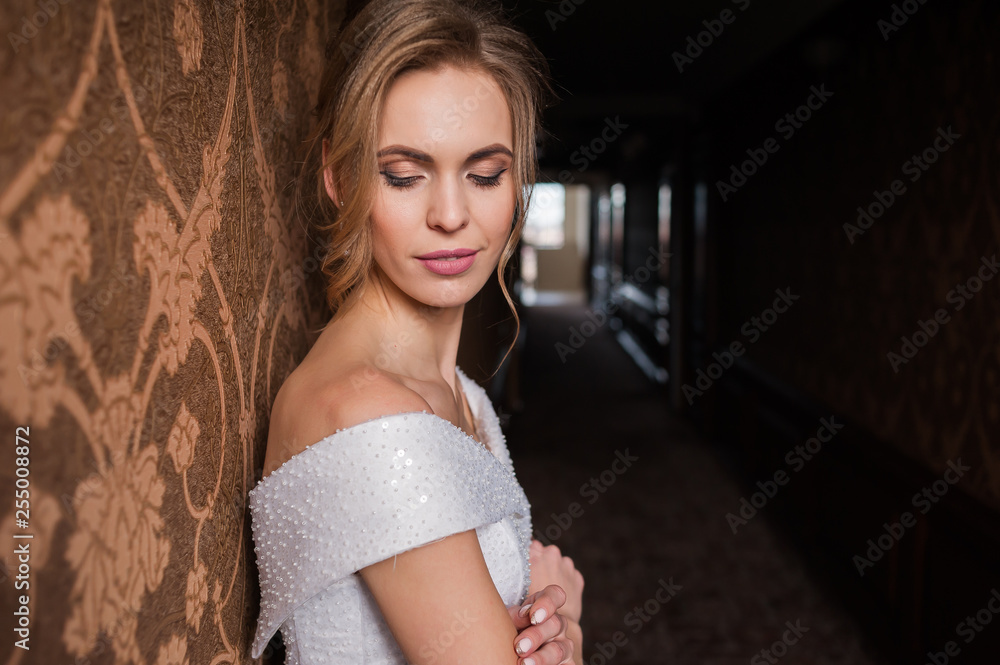 Bride.Young fashion model with perfect skin and make up brown background curly hair Bride.Young fashion model with perfect skin and make up brown background curly hair
