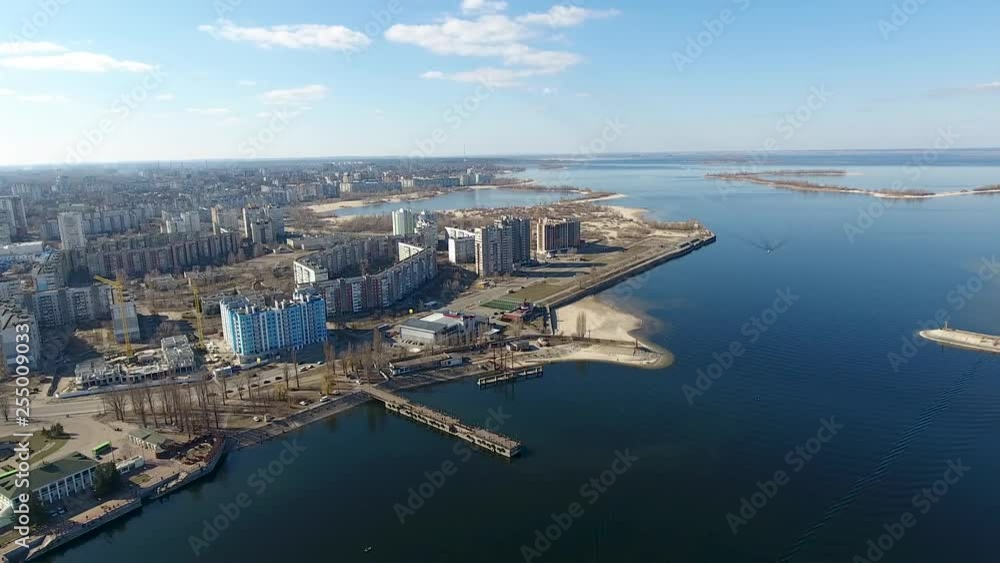 River and cargo port bird's-eye view. Cherkassy city, Ukraine. Panorama. Drone shoots the city and port from the river.