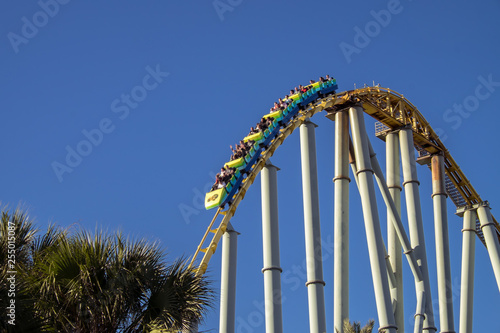 Rollercoaster dropping down at amusement park