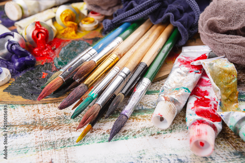 Paint brushes and paints for drawing.