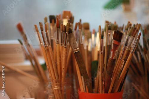 paint brushes in containers